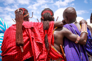 Kenyan Men with arms wrapped around each other